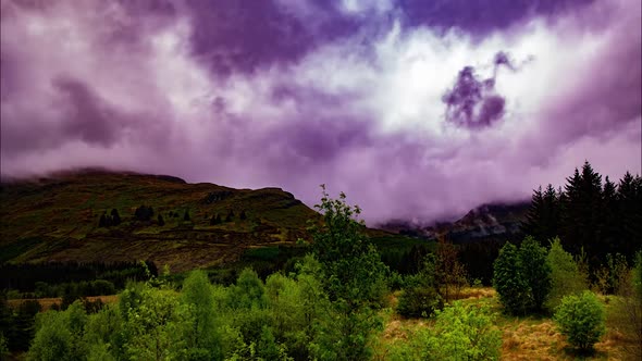 Cinematic timelapse of purple clouds over scottish highlands