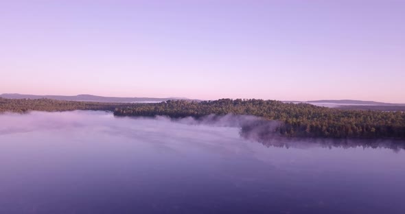 Chilly summer sunrise in northern Maine with some killer mist and colors around a small lake.