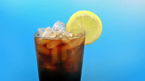 Passing Iced Coke Drink With Lemon