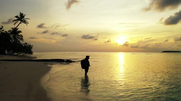 Tourist enjoys life on exotic bay beach vacation by transparent lagoon and white sand background of 