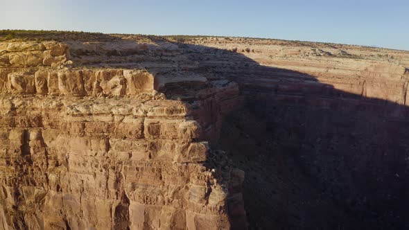 Aerial shot of the cliffs along the edge of Cedar Mesa in Southern Utah