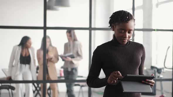 Onfident Businesswoman In Suit Working at Office