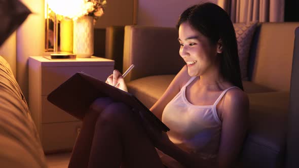 Young Asian beautiful woman enjoy using smartphone- tablet