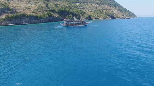 Tour boat near shore in Albania