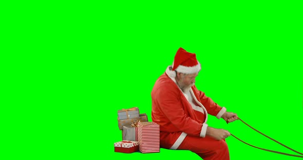 Santa claus with gift box riding on green screen 4k