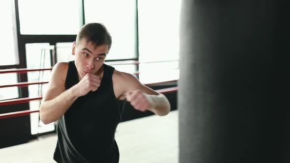 Man Boxing with Punching Bag