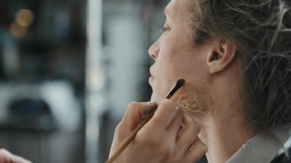 SFX Artist Applying Makeup on Prosthetic Scar