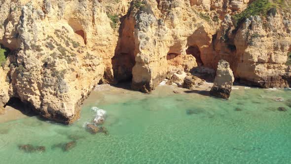 Hidden beach hideaways among the rugged cliffs of Algarve coastline, Portugal