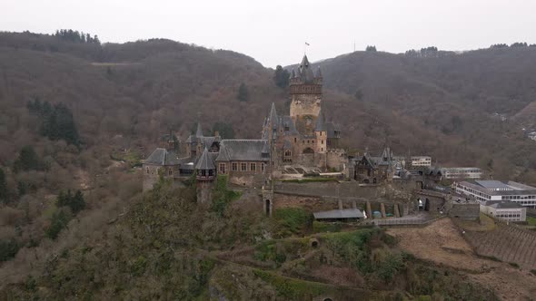 beautiful close up drone shot of the castle in cochem city next to the river moselle in germany