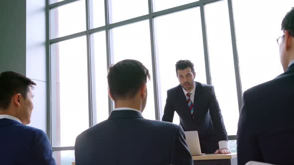 Group of Business People Meeting in a Seminar Conference