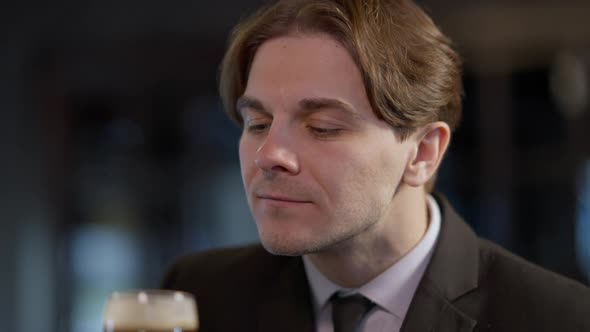 Closeup Portrait of Positive Smiling Handsome Caucasian Man in Suit Smelling Admiring Freshlybrewed