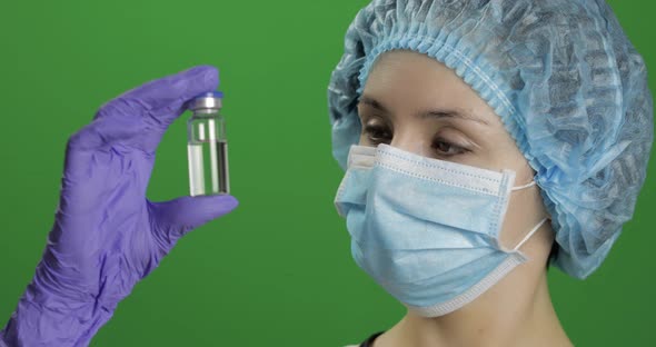 Female Scientist Holding Ampoule in Hand, New Medication Developing, Vaccination