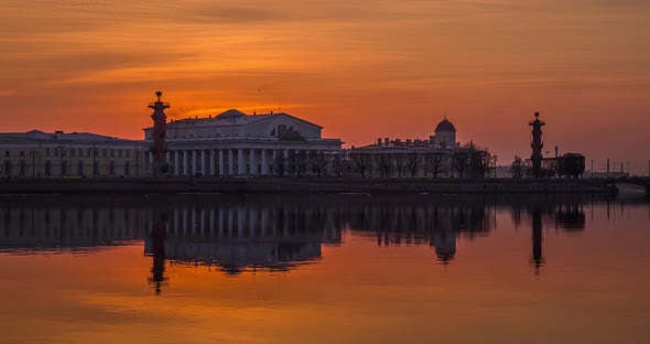 Timelapse of Old Stock Exchange Building and Rostral Columns in Dusk Water Area of Neva River at