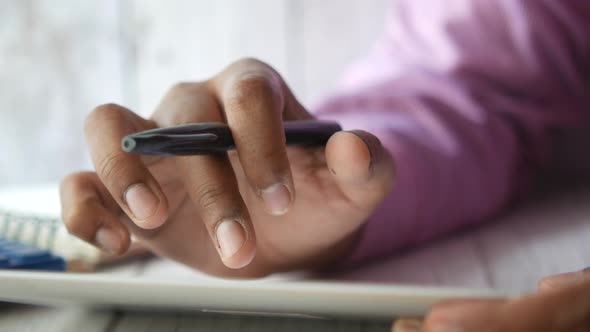 Businessman Using Digital Tablet on Office Desk