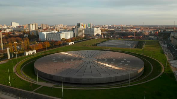 Establishing Shot Above Futuristic Velodrome Building Cycling Arena in Berlin, Germany, Aerial View