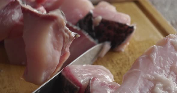 Slicing Fresh Fish Into Pieces Closeup