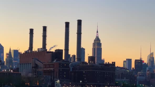 silhouetted New York City skyline cityscape at sunset golden hour view from Hudson River