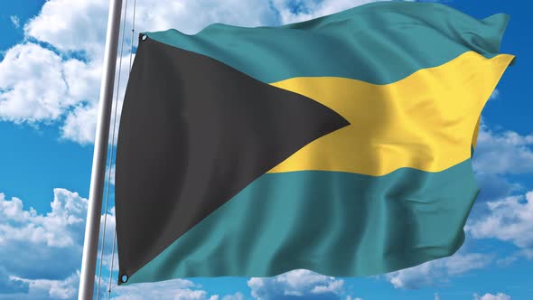 Flying Flag of Bahamas on Sky Background