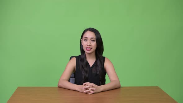 Young Beautiful Asian Businesswoman As Newscaster