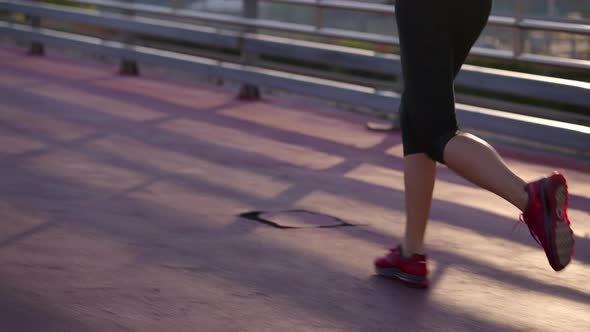 Sportswoman in Morning Jogging Training Closeup of Feet in Sporty Sneakers