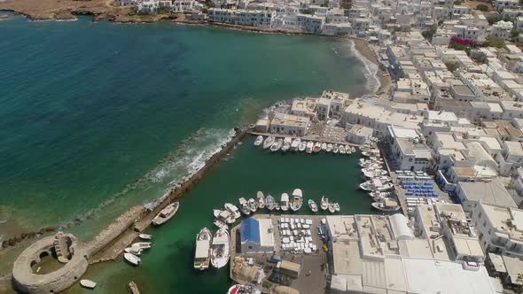 Aerial view of harbor at Naousa city, with traditional white houses, Greece.