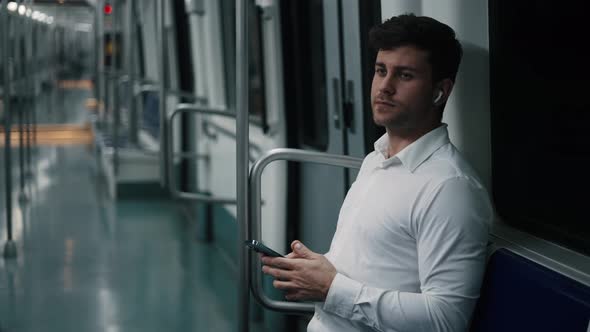 Male Manager Riding Underground Train