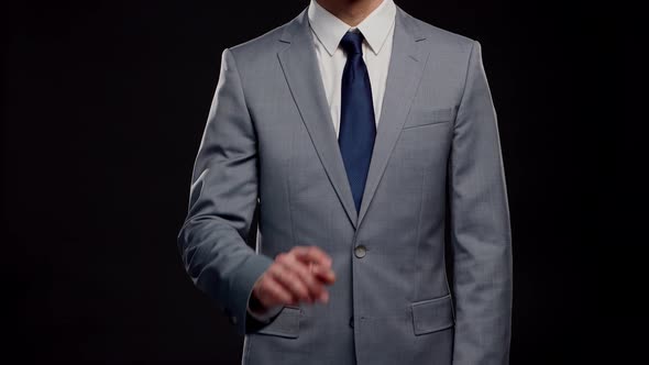 Studio portrait of successful and smart businessman in suit and tie.