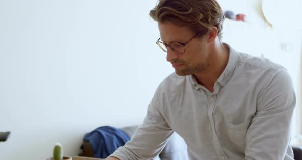 Man Writing on A Diary in Living Room 4k