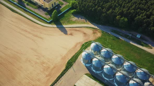 Aerial Elevated Top View Modern Granary Graindrying Complex Commercial Grain Or Seed Silos In Sunny