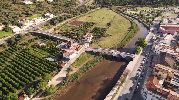 Rotating aerial of Ponte Velha, the monumental arched bridge in Silves, Portugal