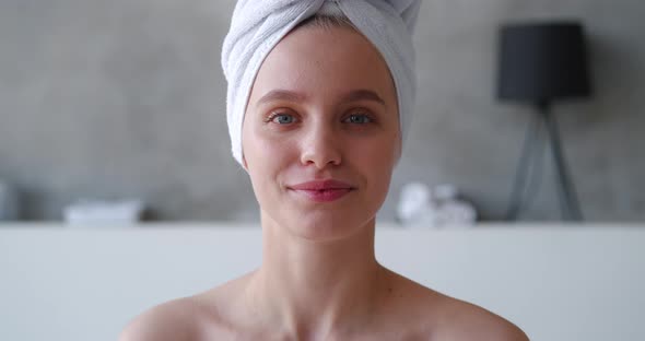 Confident Closeup Beauty Portrait of Attractive Sensual Blonde Woman with Head Wrapped in White