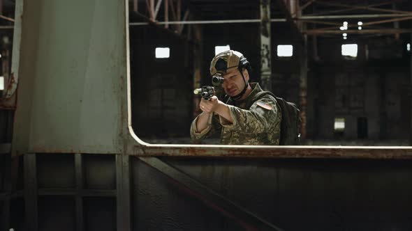 American Soldier Aiming Through Window of Bus