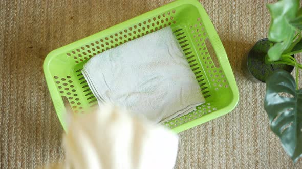 Top View of Clothes in Basket on Floor