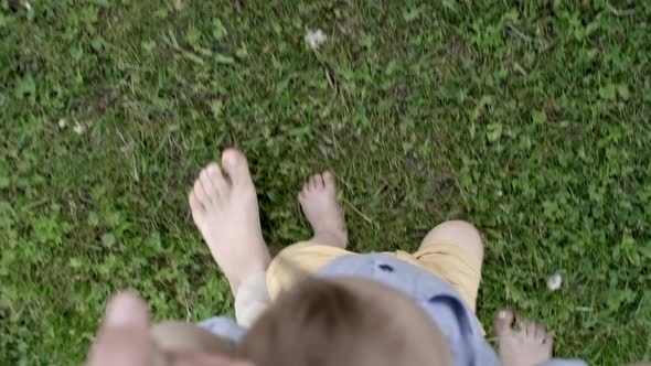 POV of Mother Teaching Toddler to Walk alt