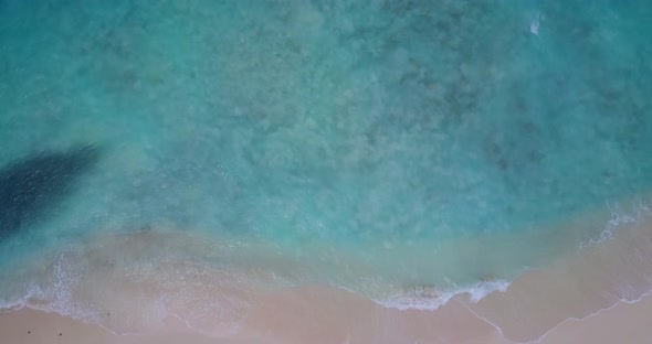 Wide above abstract shot of a white sandy paradise beach and blue ocean background in best quality 4