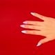 Woman's Hand with Beautiful Nails on Red Background - VideoHive Item for Sale
