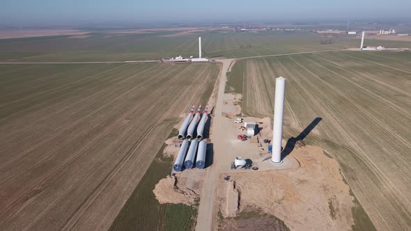 Construction Site with Windmill Turbine Parts on Ground