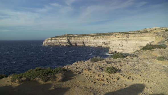 Dark Blue Deep Mediterranean Sea Waving in Wind near Coastline of Gozo Island