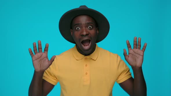 Excited Black Man Saying Wow Over Blue Background