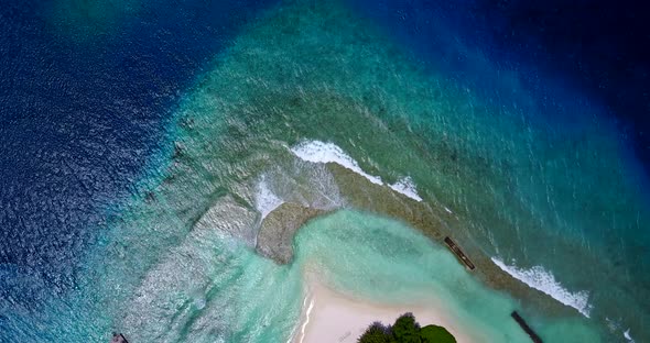 Wide angle fly over abstract view of a white sandy paradise beach and blue water background in hi re