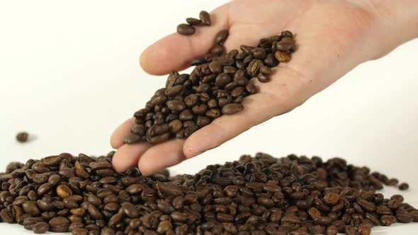 Coffee Beans In Man Hand