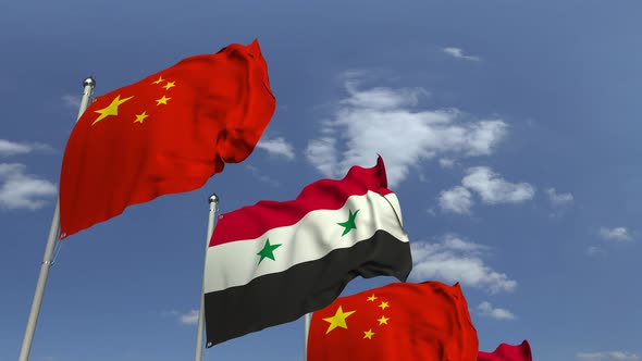 Flags of Syria and China Against Blue Sky alt