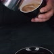 Barista pouring milk in hot coffee and making cappuccino foam in cafe close up, vertical - VideoHive Item for Sale