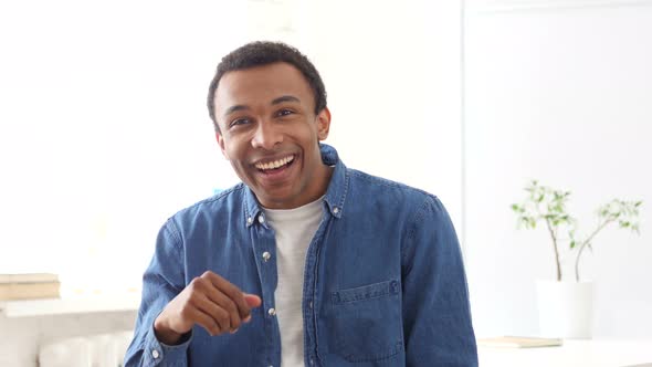 Shocked Afro-American Man, Portrait at Work, Amazed by Surprise