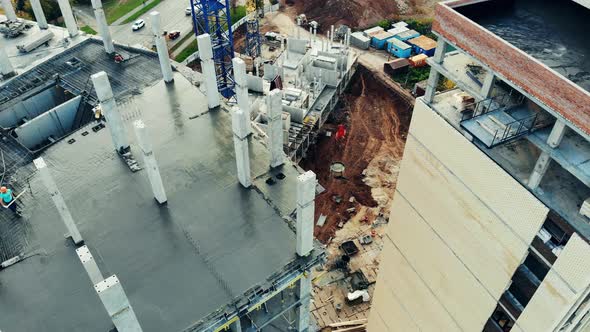 A Construction Site with Workers and Machines.