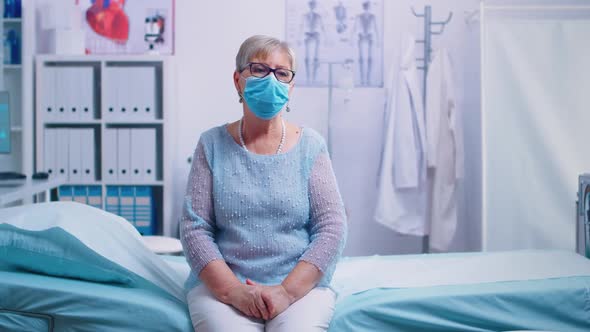 Lonely Senior Woman in Hospital Bed