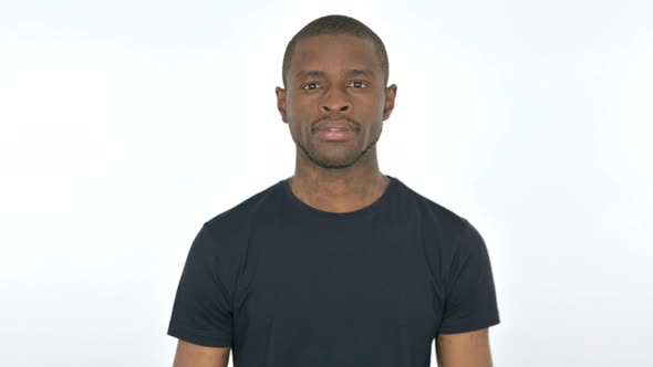 Serious Young African Man Looking at the Camera on White Background