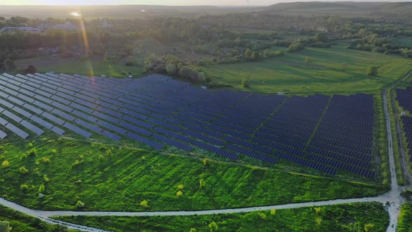 Ecology solar power station panels in the fields green energy at sunset