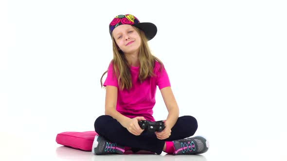 Teen with Console Playing Video Game, Slow Motion. White Background alt