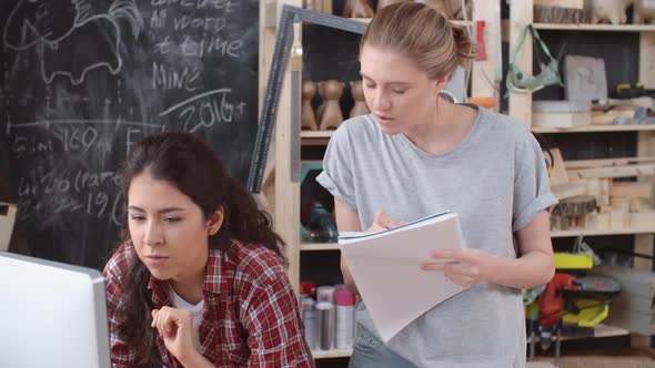 Women Making Notes on New Project